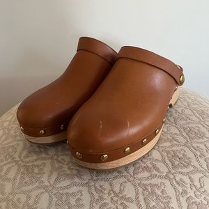 J Crew tan clogs with gold details.